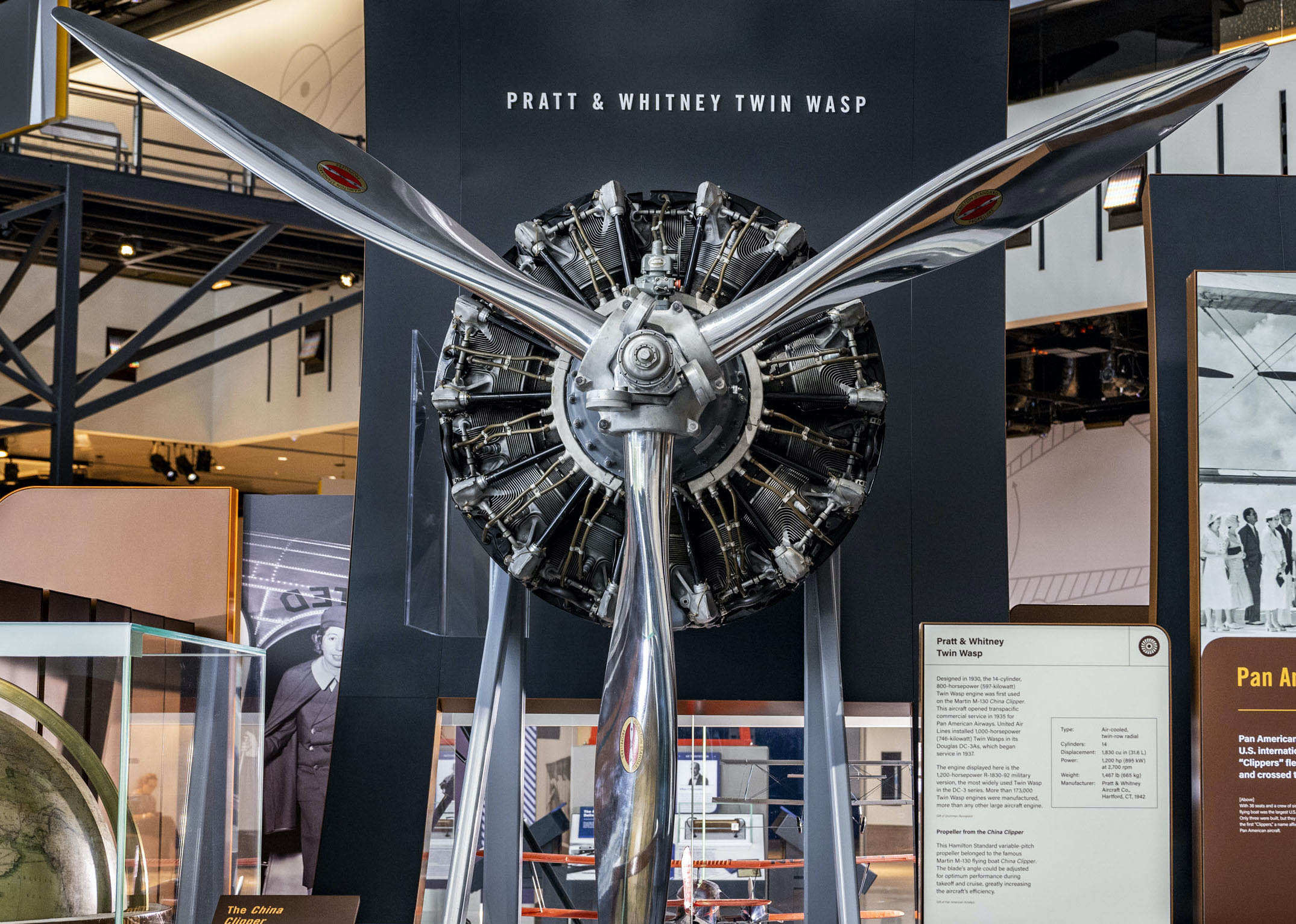 Fourteen-cylinder twin-row radial engine with a three-blade metal propeller and staggered black cylinders.