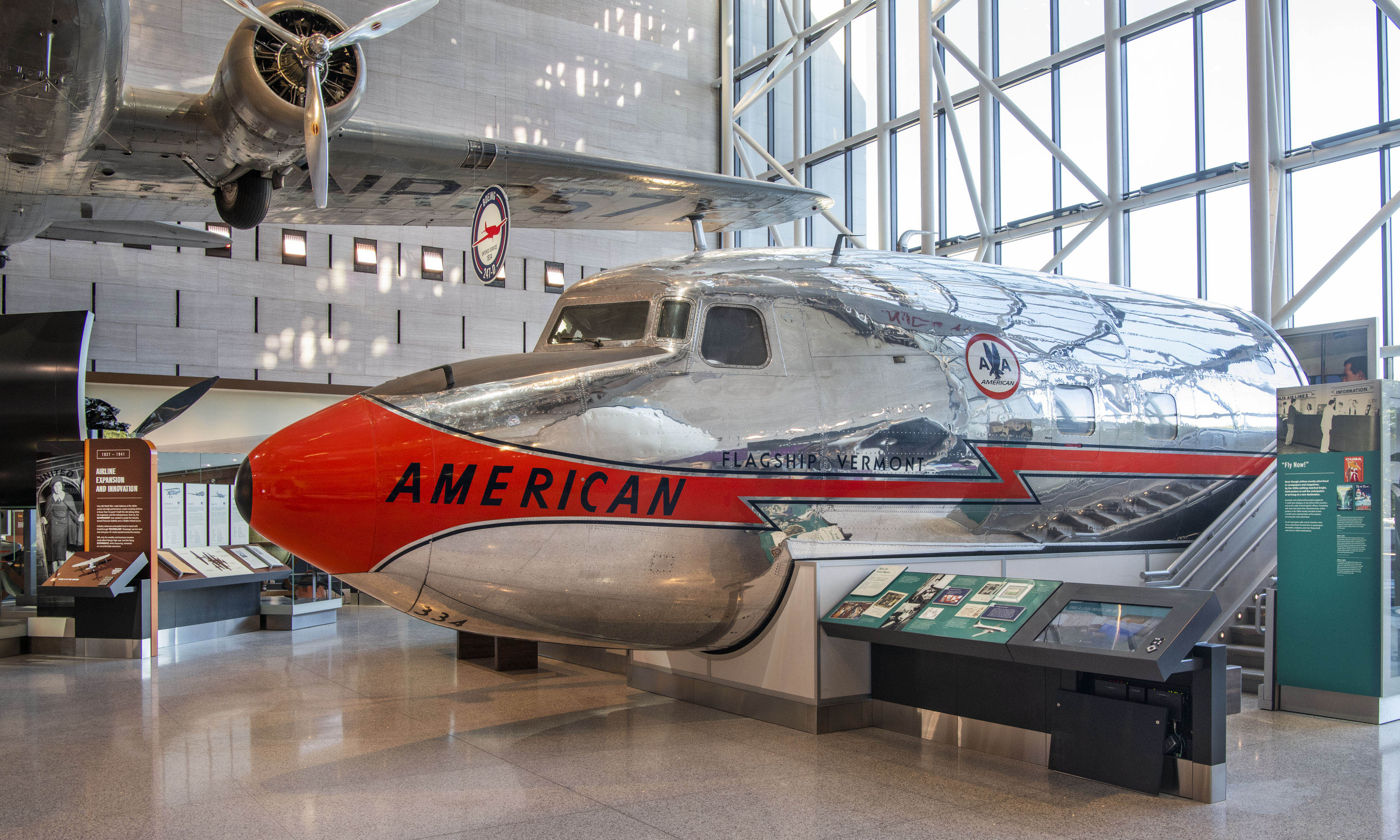 Silver and orange American Airlines DC-7 nose section marked Flagship Vermont.