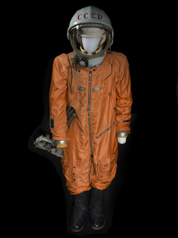 A bright-orange full-body pressure suit on a mannequin with an attached white helmet marked CCCP in red letters.