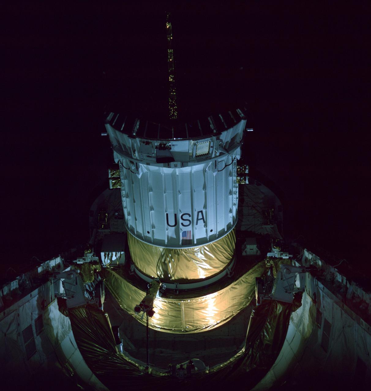 The first TDRS and its upper stage in deployment position aboard Challenger in April 1983.
